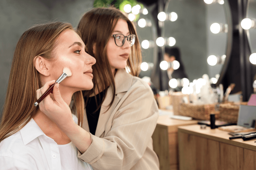 make-up-artist-woman-looking-mirror-applying-contouring-1-1